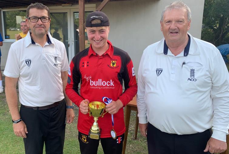 Man of the Match Corey Hall with the umpires Huw and Chris